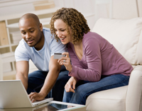 Couple looking at finances on computer