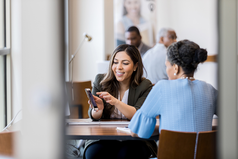 credit union employee helping member