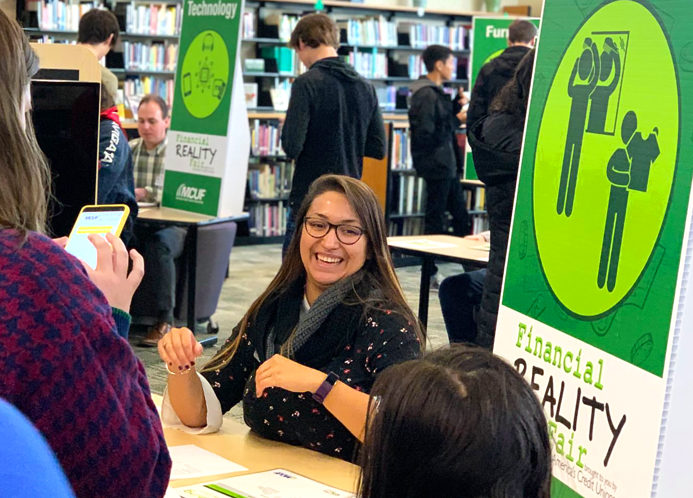 Genisys Credit Union hosting a financial reality fair at a local high school