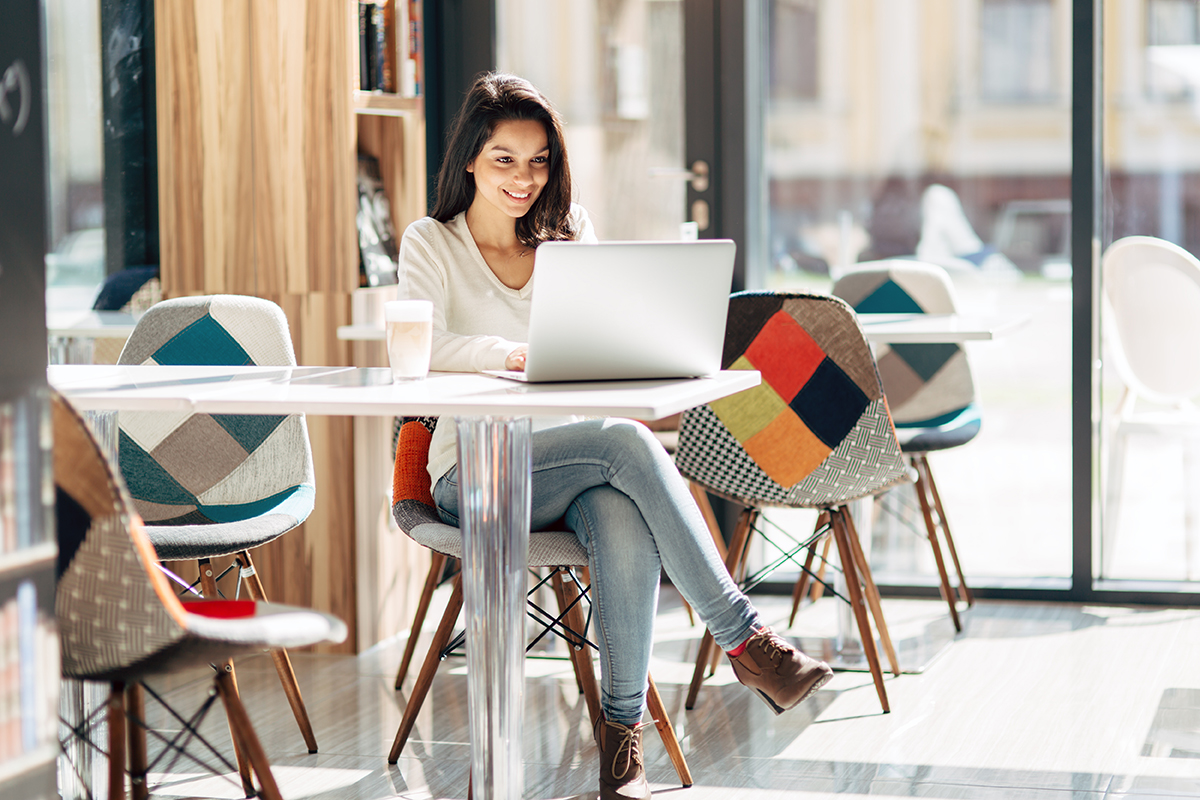 Woman in coffee shop using a laptop