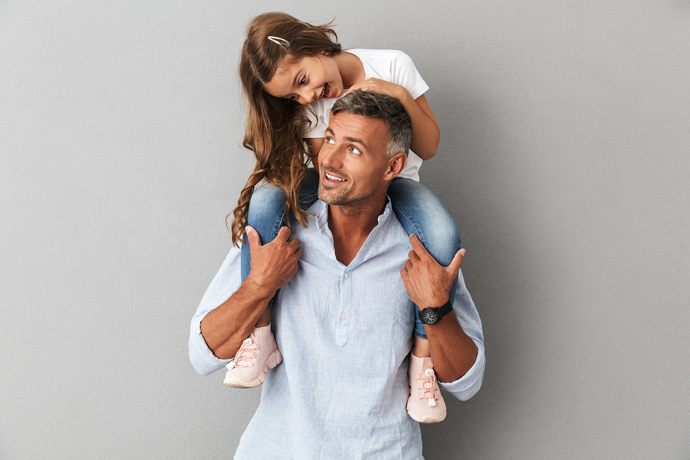 image of father with his daughter on his shoulders