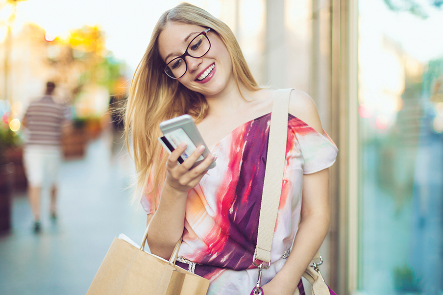 woman using smartphone downtown