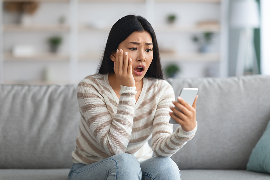 woman looking at smartphone