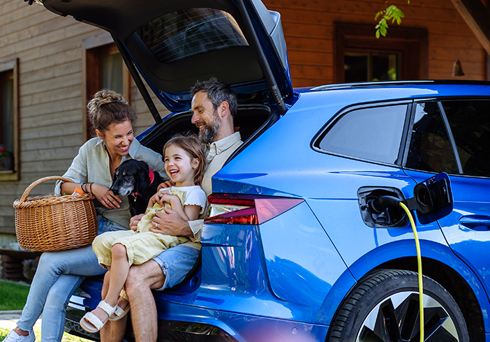 family sitting in trunk
