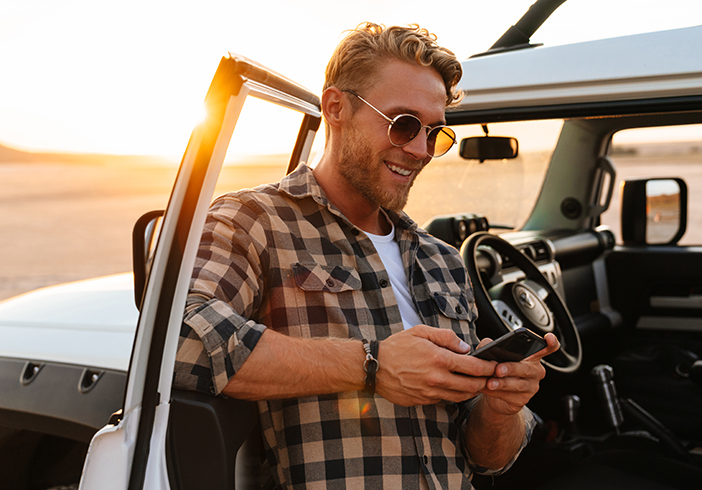 Man in front of car