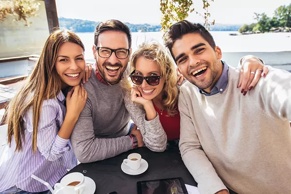 Group of friends taking a selfie at a restaurant