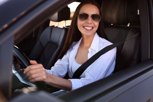 Woman in car smiling