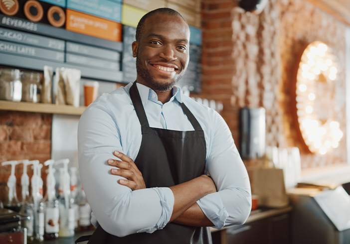 Cafe owner standing behind the counter
