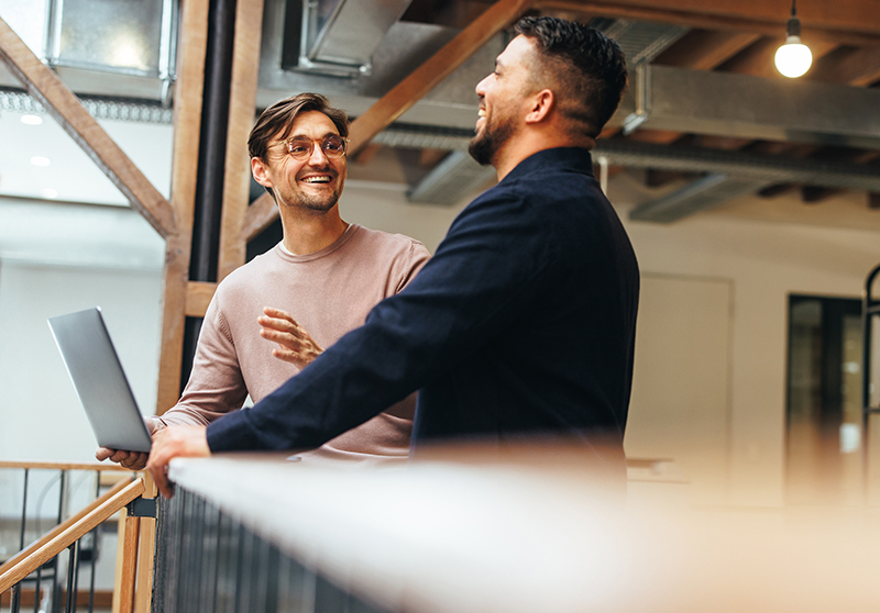 Business men talking in an office setting