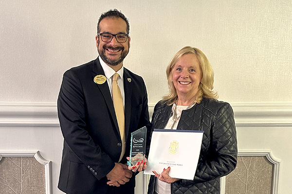 Anthony Gallina, Senior Director Alumni Engagement of Oakland University and Theresa Doan, Director Social Responsibility of Genisys Credit Union