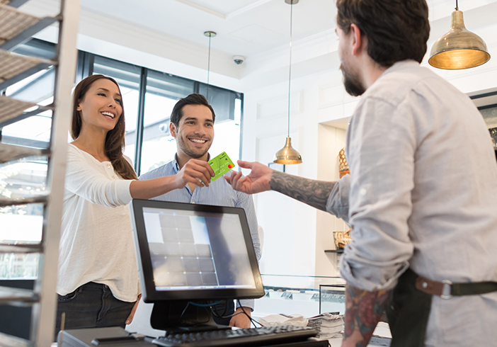 Woman handing over credit card
