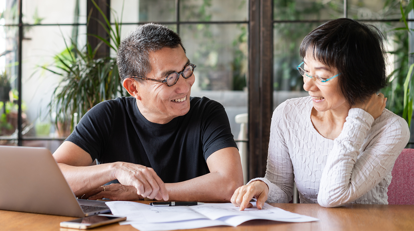 Couple looking at desk