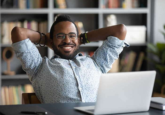 man sitting back in chair