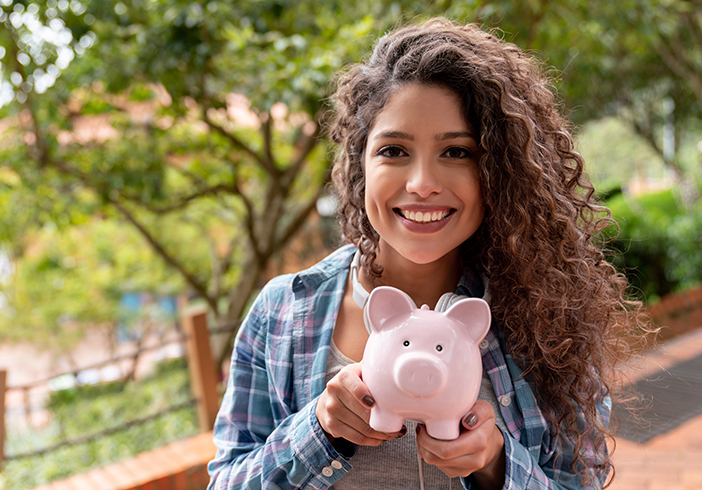 woman holding piggy bank