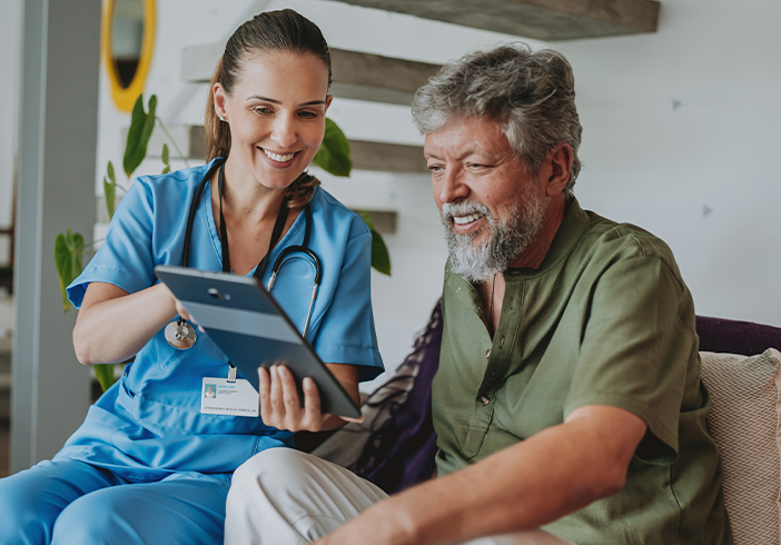 Nurse showing a patient information on a tablet
