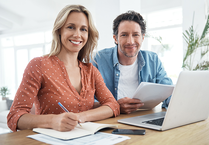 Couple sitting together reviewing their finances