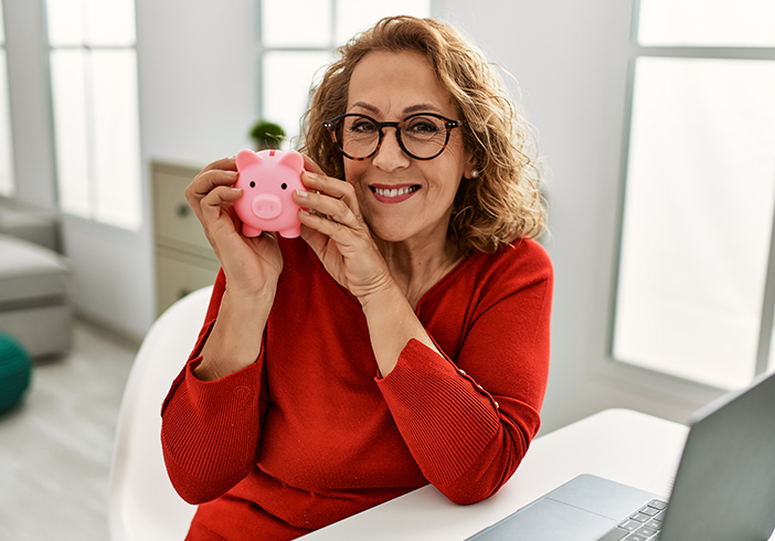 Woman holding a piggy bank
